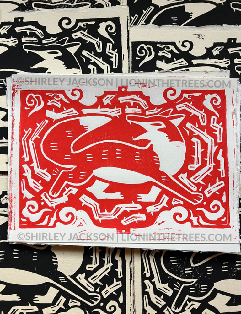 Linoblock print featuring a fox in motion surrounded by thorns. This print is all red.