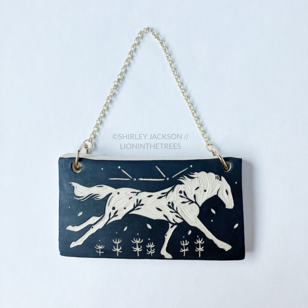 Ceramic black sgraffito wall slab featuring my Running Horse motif
