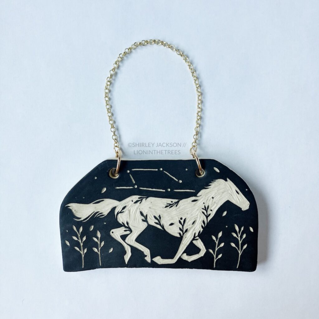 Ceramic black sgraffito wall slab featuring my Running Horse motif