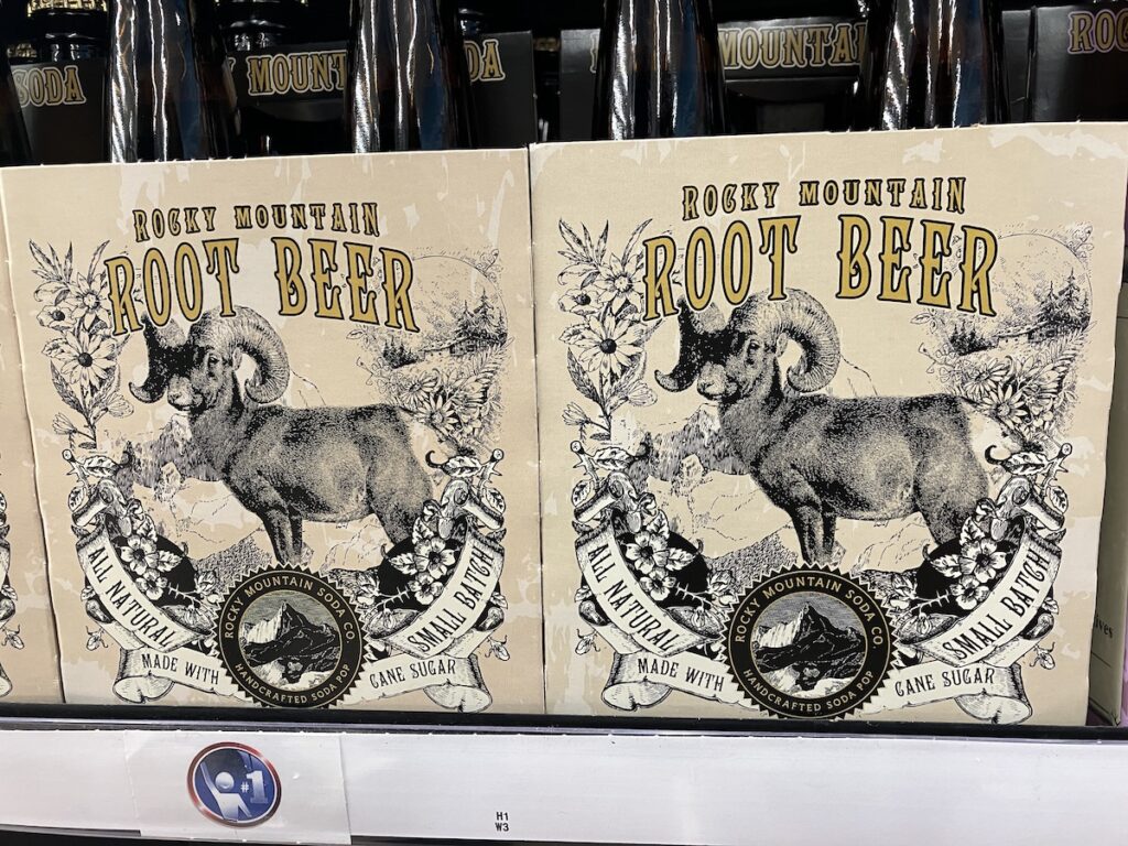 Rocky Mountain Soda Co.'s Rocky Mountain Root Beer pop that shows a vintage styled illustration of a Big Horned Sheep done in black against a cream coloured background.