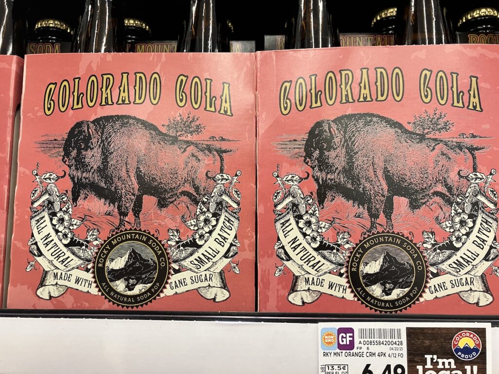 Rocky Mountain Soda Co.'s Colorado Cola pop that shows a vintage styled illustration of an American Bison done in black against a red background.