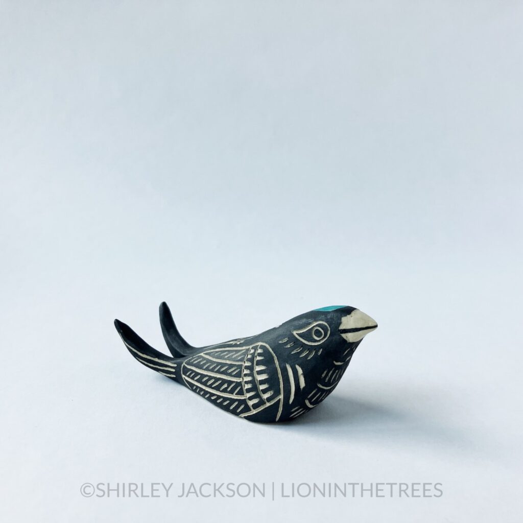 Ceramic black sgraffito Barn Swallow totem.