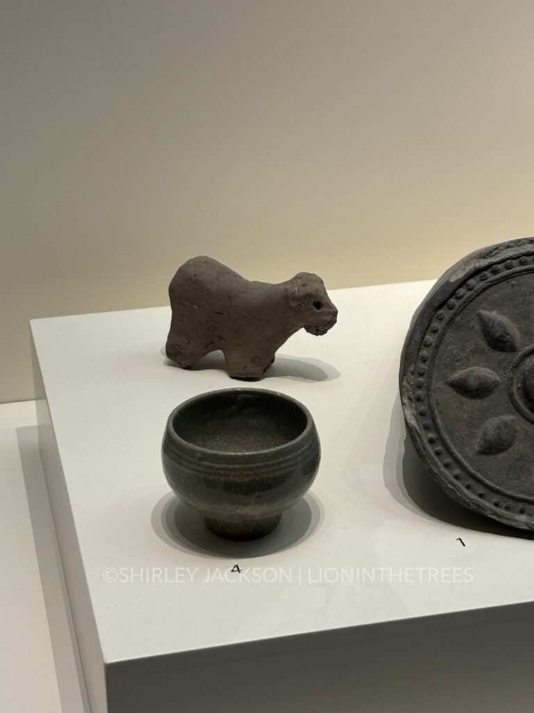 Photo of a clay sculpture that looks like a little sheep.