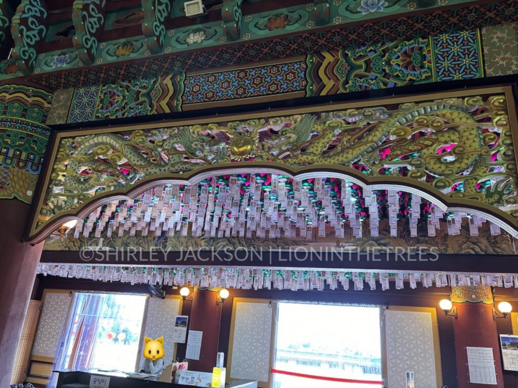 Photo of an intricately carved dragon mural