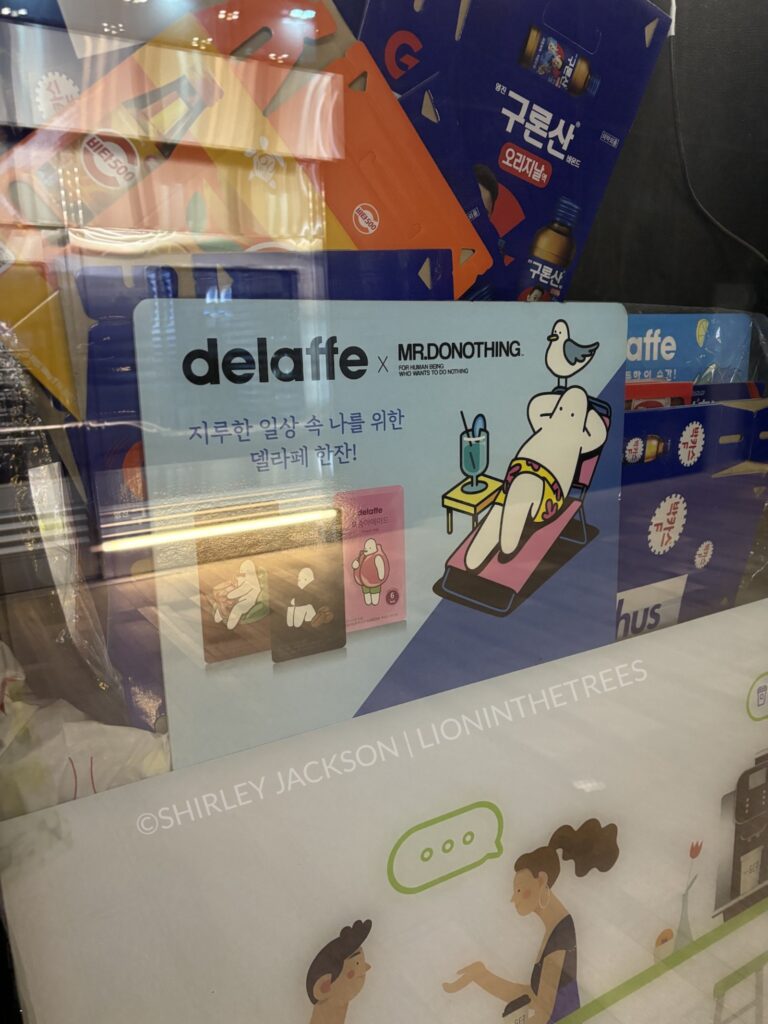 A photo of an advertisement for delaffe x mrd.donothing. It portrays a white (not caucasian - they're literally white) hanging out on a pool chair with a seagull on their head.