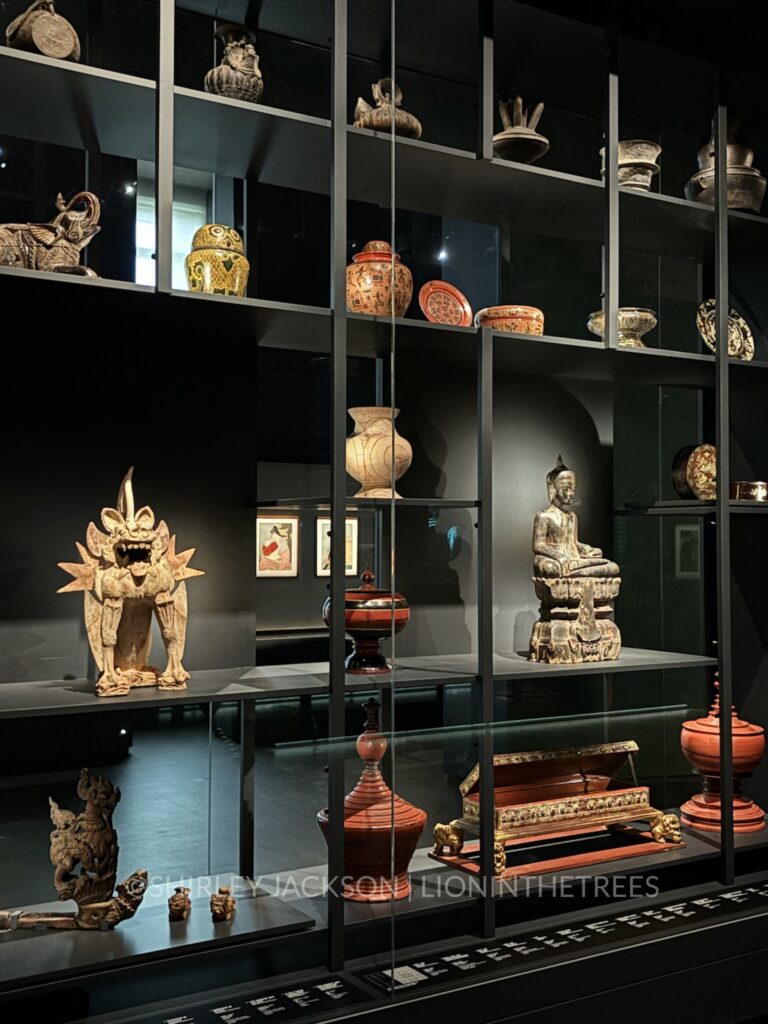 A photo of a collection of different objects ranging from jars to sculptures