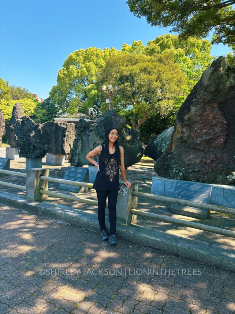 Photo of me in front of some very large volcanic rocks