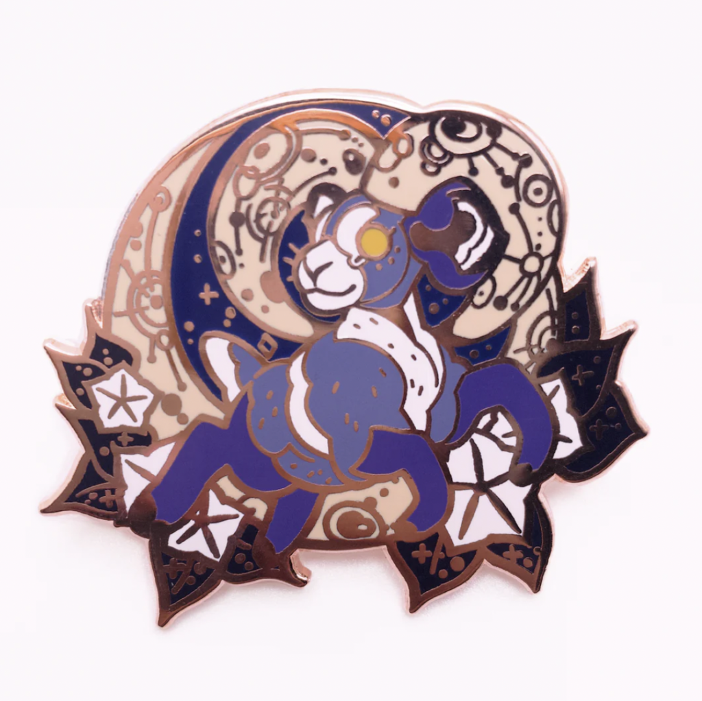 An enamel pin featuring a big horn ram leaping in front of a moon. Made by Aspen Eyes.