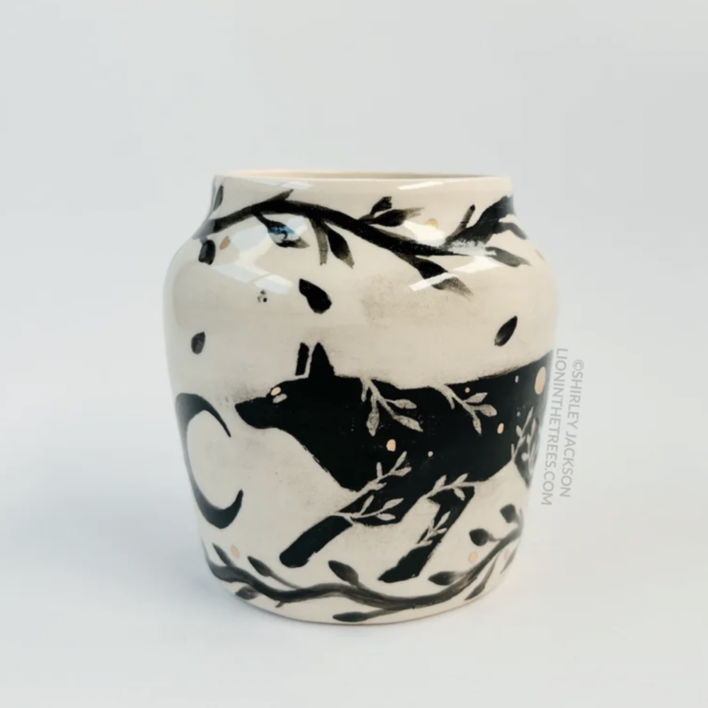 Ceramic vessel featuring my double Running Wolf motif with crescent moon details. This vase also features a floral border above and below the Wolf motifs, and gold overglaze details.