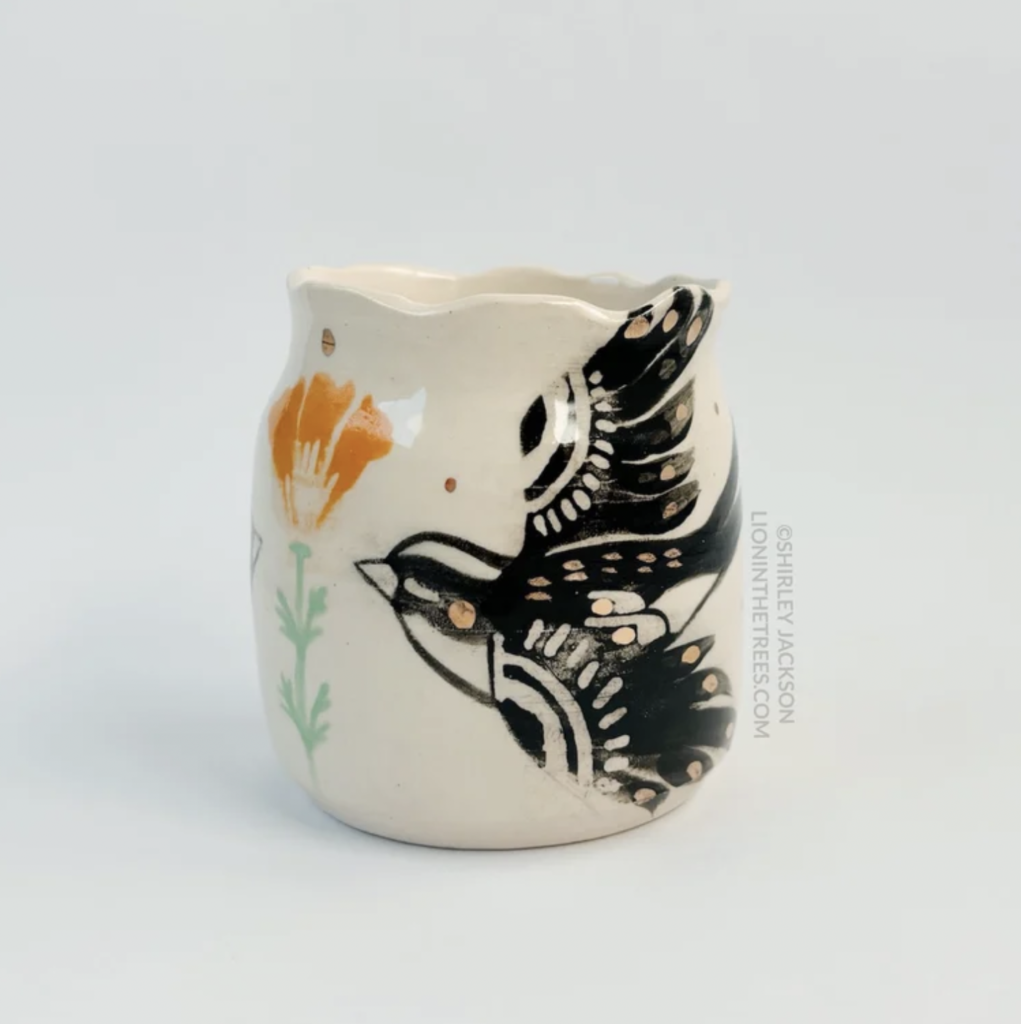 Ceramic vessel featuring my double Barn Swallow motif with a California Poppy motif in the center of the two birds. Features gold overglaze details.