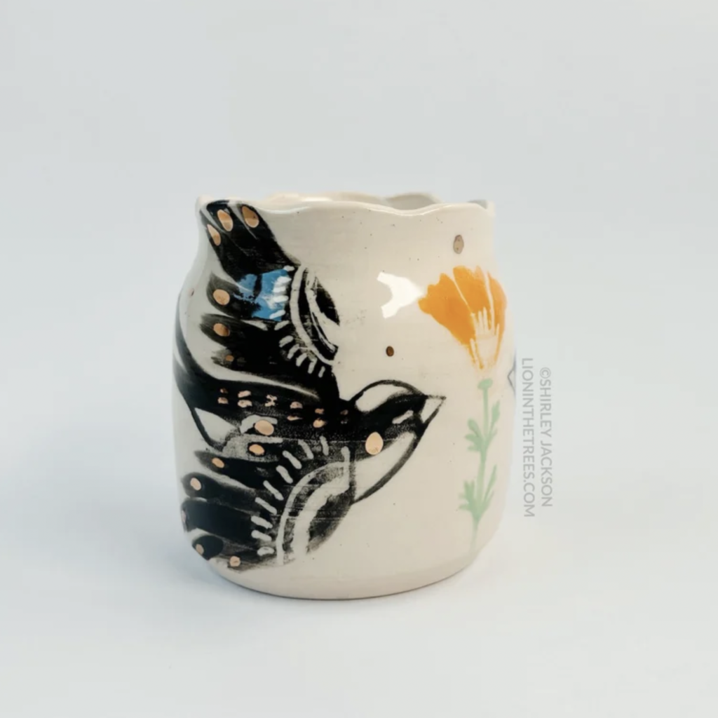 Ceramic vessel featuring my double Barn Swallow motif with a California Poppy motif in the center of the two birds. Features gold overglaze details.