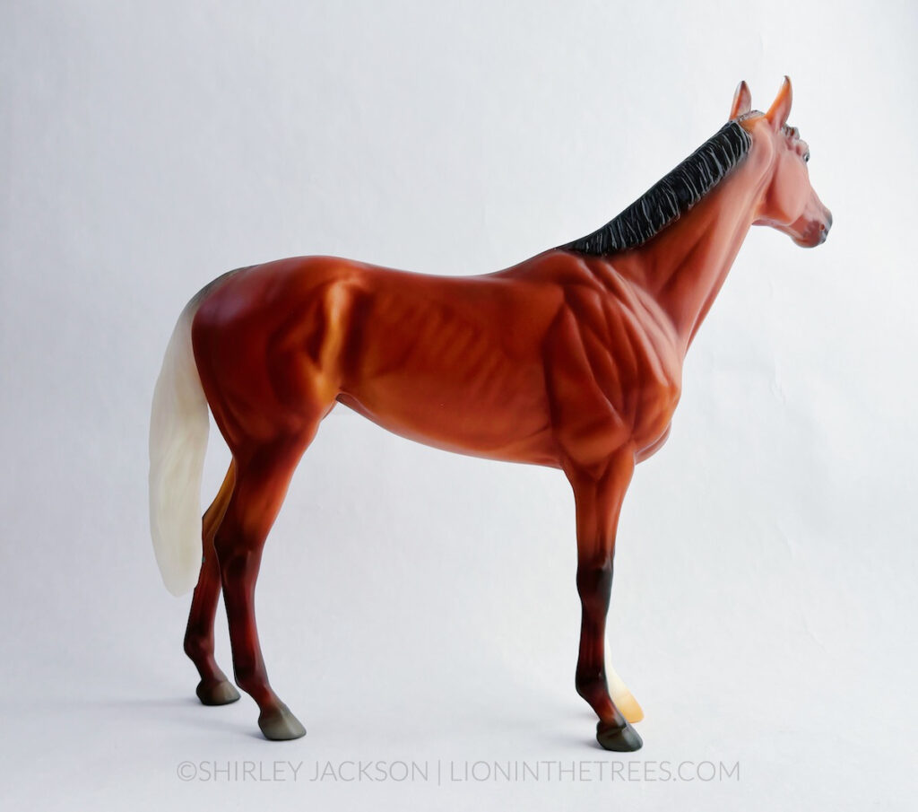 Back side view of the surprise model horse done on the Winx mold. This is the Wild Bay with Gulastra Plume variant so she has a white coloured tail.