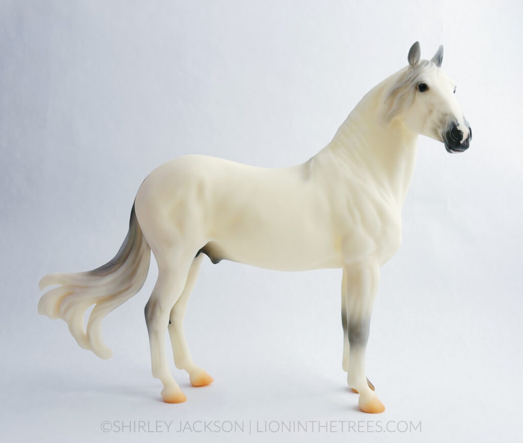 Show side view of Gascon. He was done on the latest Paso Fino mold with a white/grey coat.