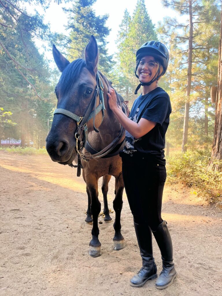 Photo of me and Dusty, the dun Mustang mare cheesing it up for the camera.