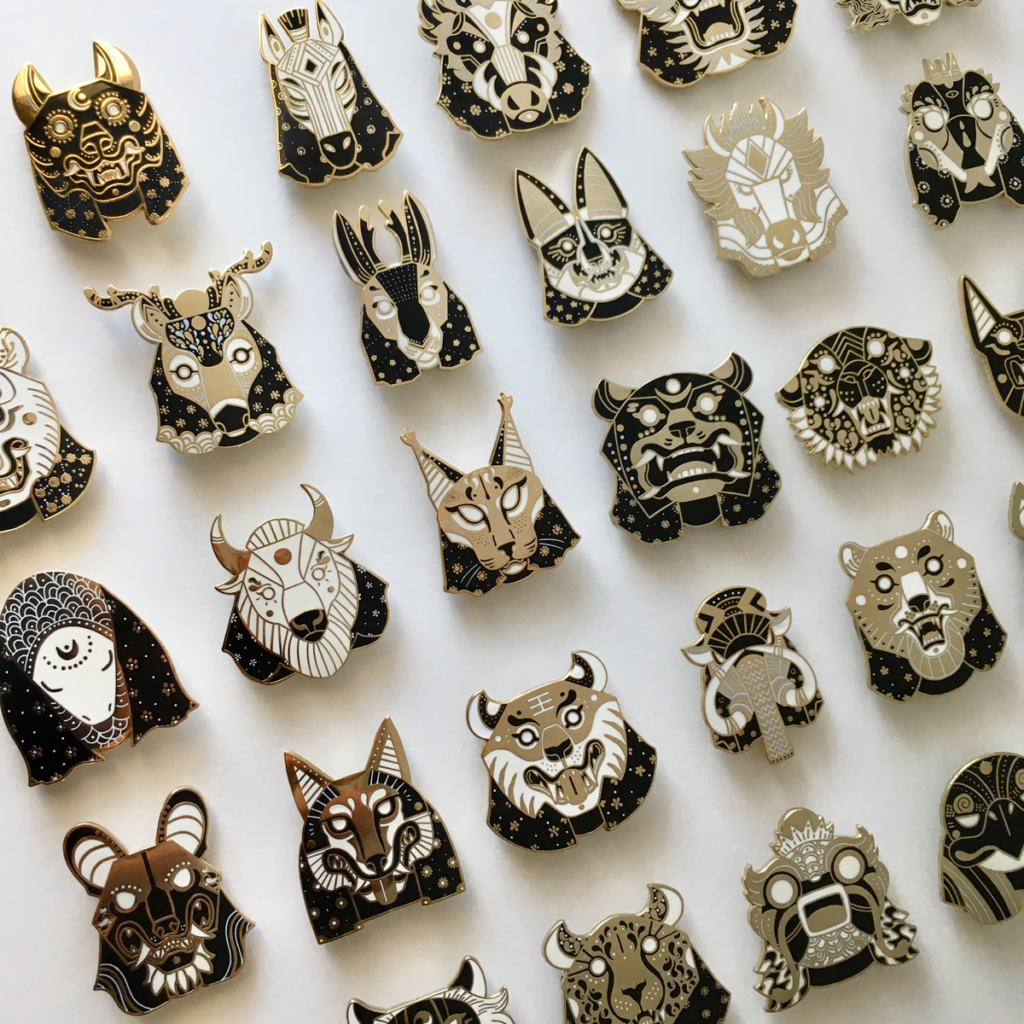 A photo showing the Oracles of the Wild enamel pin collection.