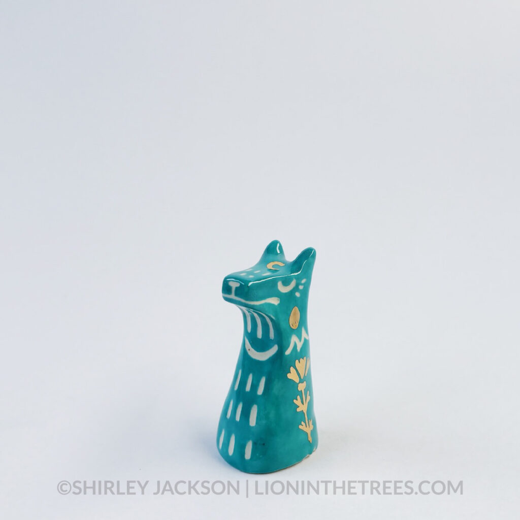 Small turquoise sgraffito wolf totem.