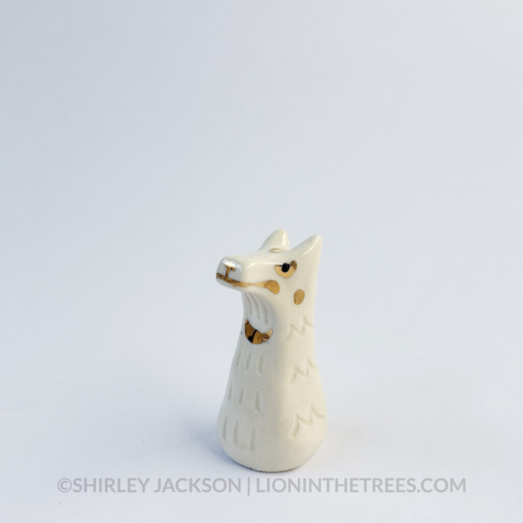 Small white sgraffito wolf totem.