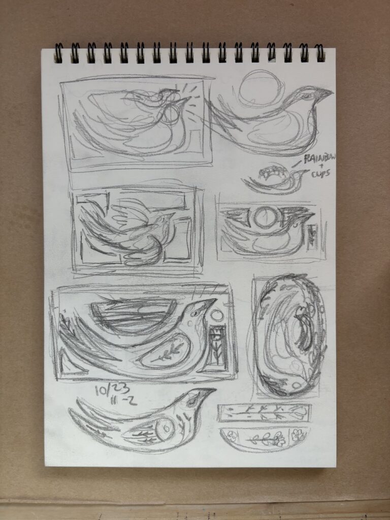 photo of a sketchbook page showing various layout compositions