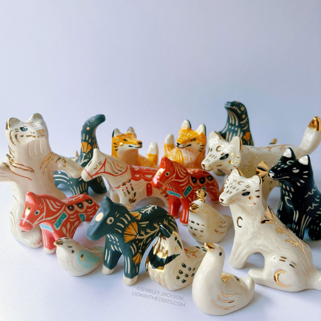 Group photo of the majority of October pottery. This update features several birds, horses, wolf/canines, dinosaurs, and a tiger.