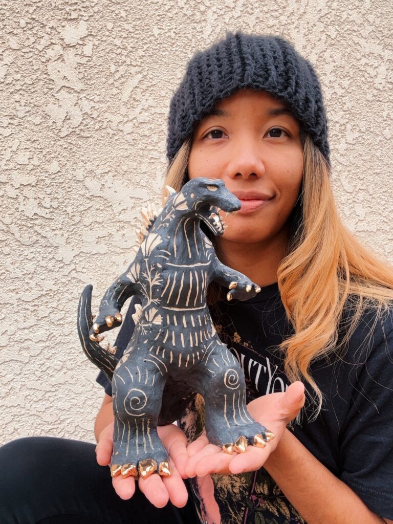 Me, holding the Godzilla in my hands with a Marge Simpson vibe like, "I just think they're neat."