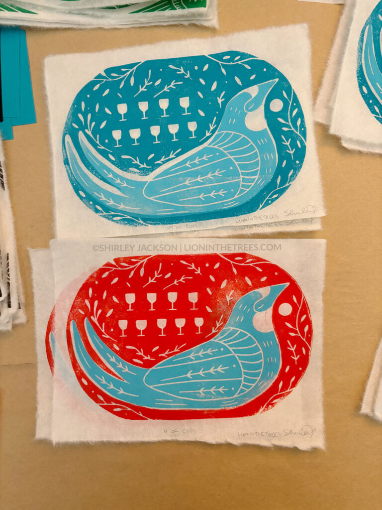 Collection of swallow prints featuring a blue and red background and turquoise birds.