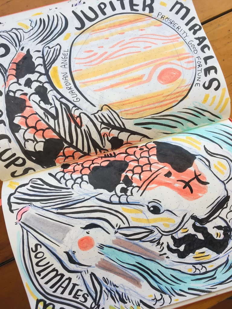 Marker and ink sketch of a koi fish circling in opposition to a dragon resembling Haku from Spirited Away. The planet Jupiter is in the background with a variety of words and phrases filling the gaps of the page.