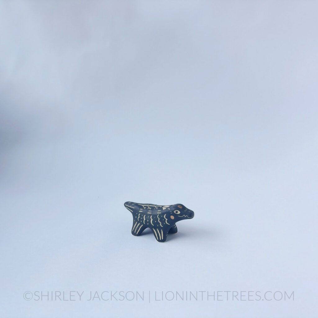 Mini Menagerie alligator totem done with black underglaze and gold gilding.