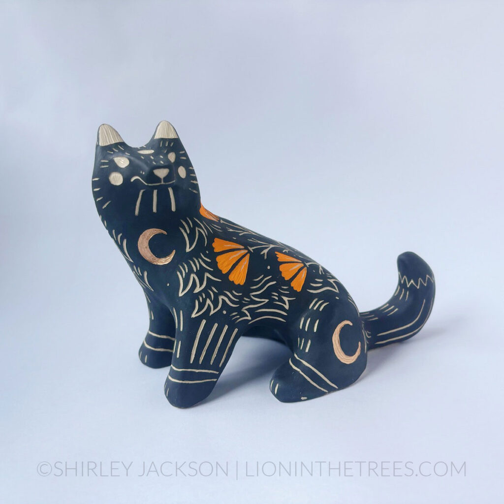 Sitting Wolf totem done with various underglazes and gold gilding.