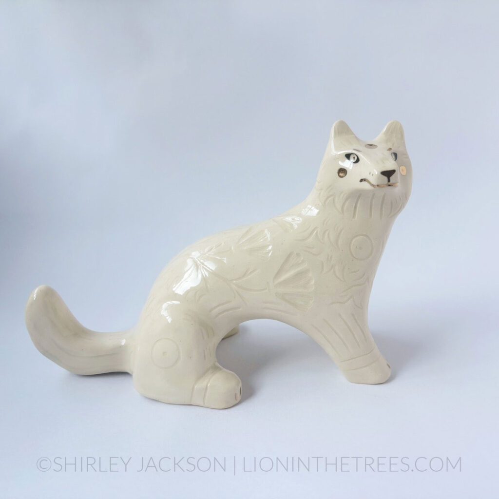 Sitting White Wolf totem done with gold luster.